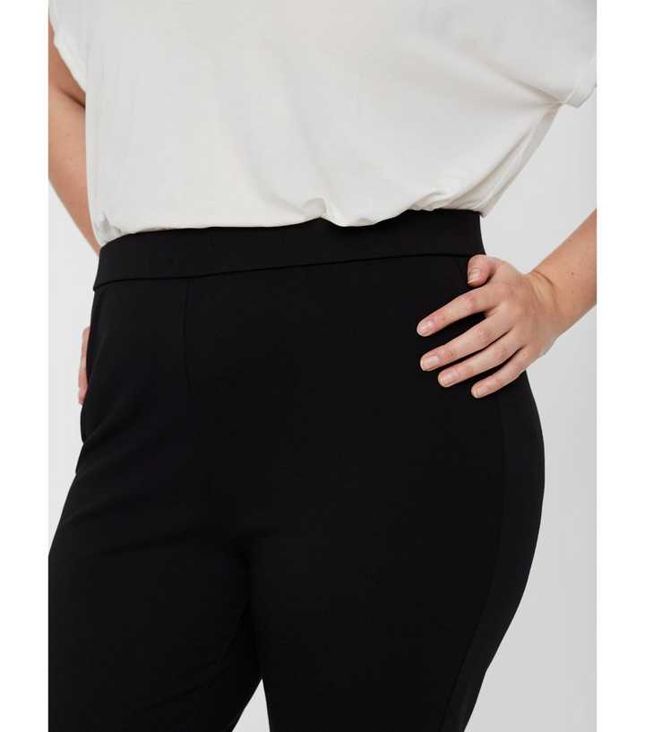 Vero Moda Petite jersey flared pants in black