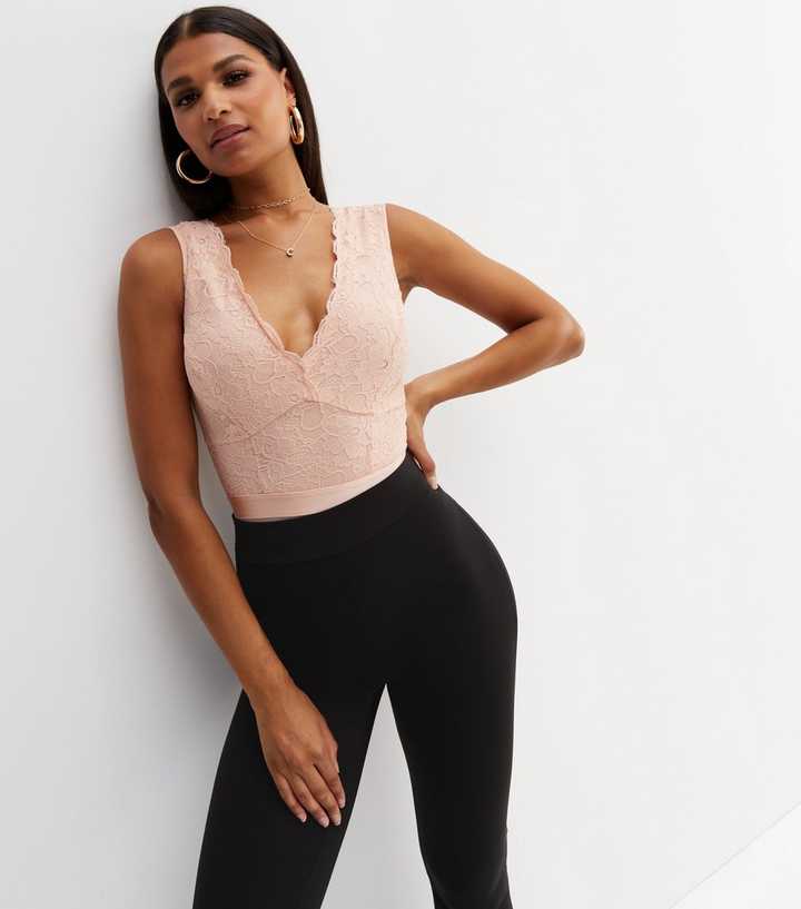 https://media3.newlookassets.com/i/newlook/841641972/womens/clothing/tops/pale-pink-lace-v-neck-open-back-bodysuit.jpg?strip=true&qlt=50&w=720