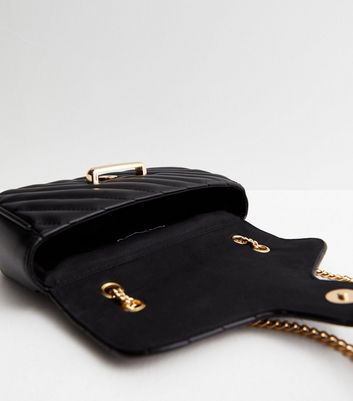 Black crossbody purse with guitar strap