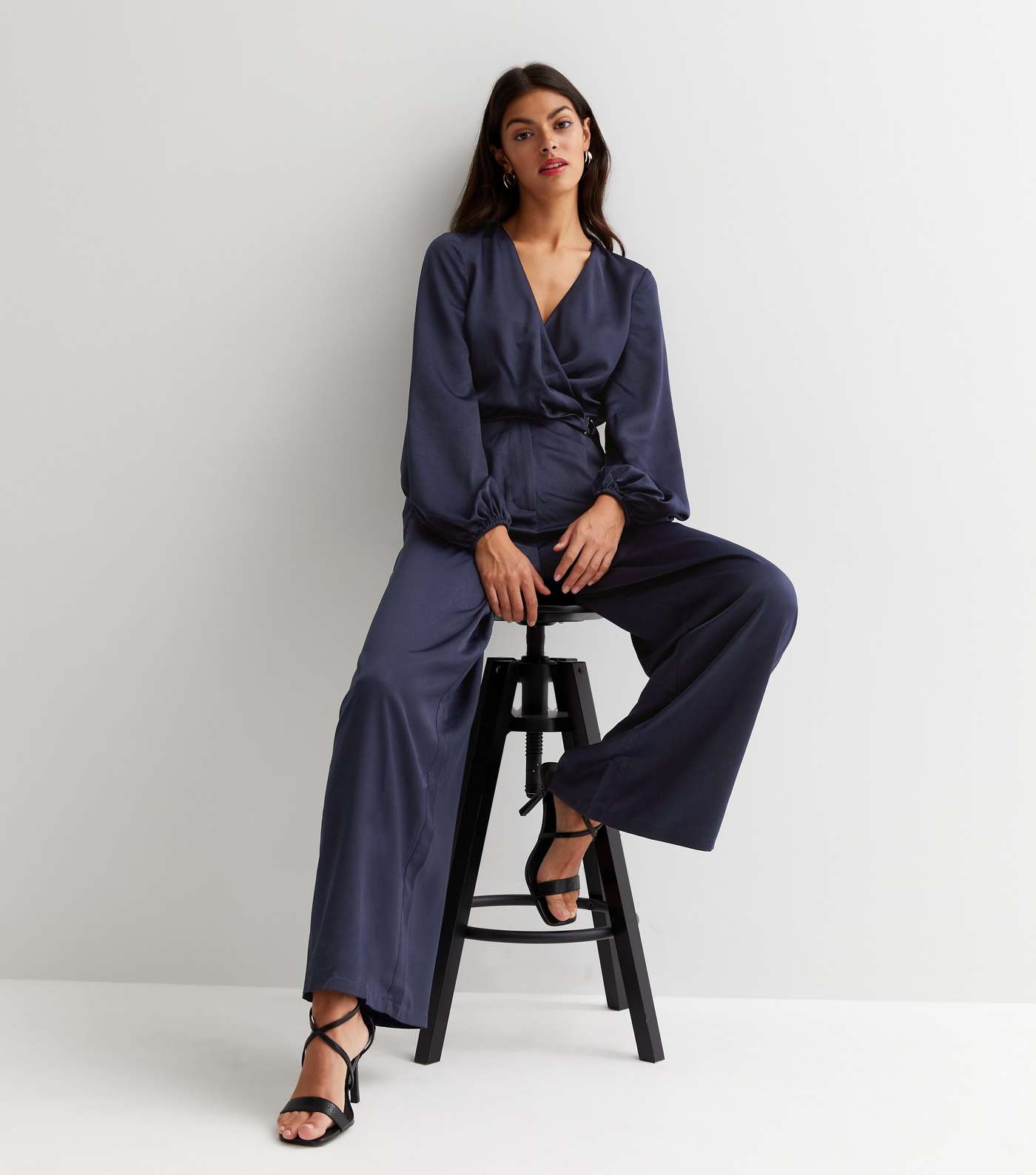 Little Mistress Navy Satin Long Puff Sleeve Belted D-Ring Wrap Jumpsuit