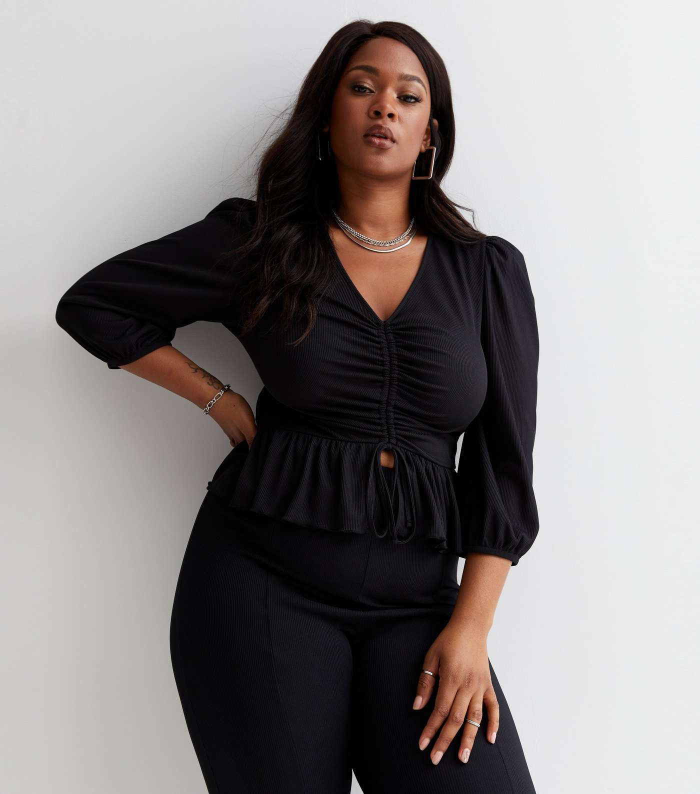 Curves Black Ribbed Ruched Puff Sleeve Peplum Top