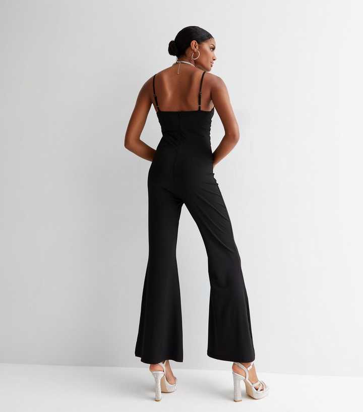 https://media3.newlookassets.com/i/newlook/847575901M3/womens/clothing/playsuits-jumpsuits/cameo-rose-black-ruched-strappy-flared-jumpsuit.jpg?strip=true&qlt=50&w=720