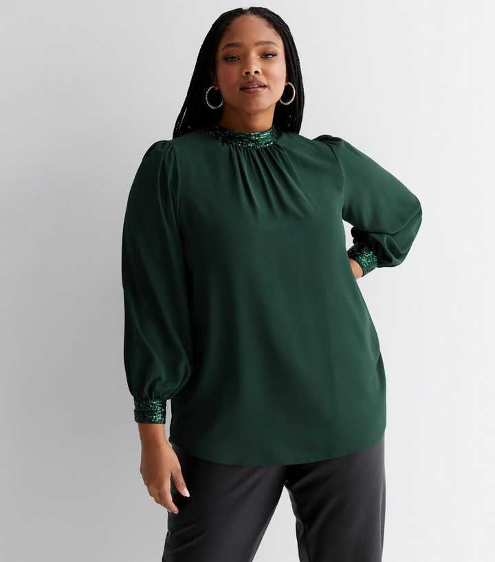 https://media3.newlookassets.com/i/newlook/848259238M1/womens/clothing/tops/curves-dark-green-chiffon-sequin-trim-long-sleeve-blouse.jpg?strip=true&qlt=50&w=720