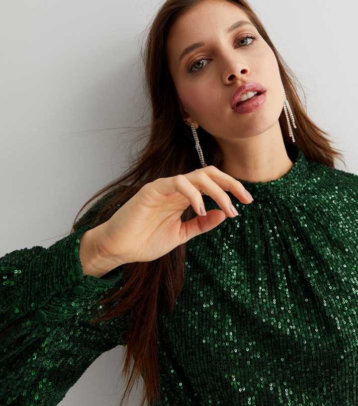 https://media3.newlookassets.com/i/newlook/849252935M1/womens/clothing/tops/gini-london-green-sequin-high-neck-long-sleeve-blouse.jpg?strip=true&qlt=50&w=720
