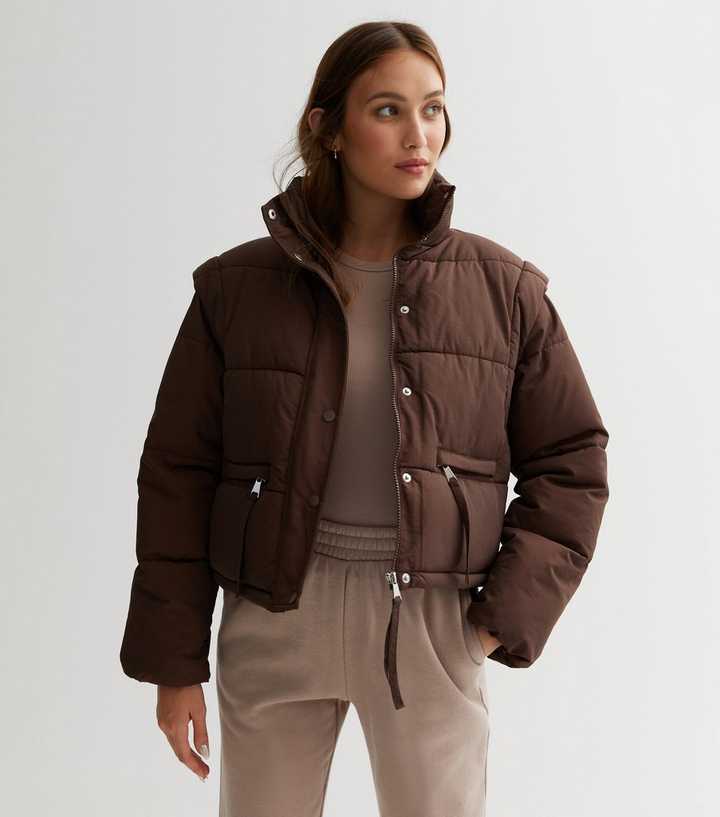 https://media3.newlookassets.com/i/newlook/849483627/womens/clothing/coats-jackets/jdy-dark-brown-detachable-sleeve-crop-puffer-jacket.jpg?strip=true&qlt=50&w=720