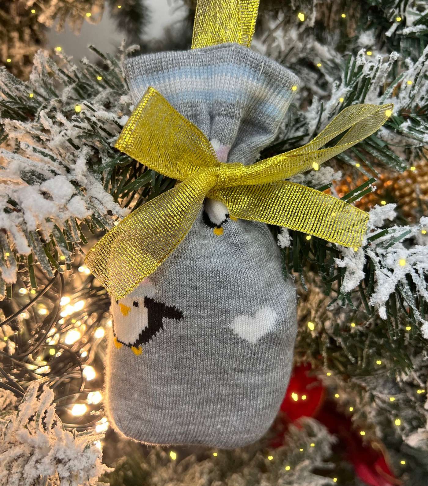 Loungeable Light Grey Penguin Socks in a Sock Bag