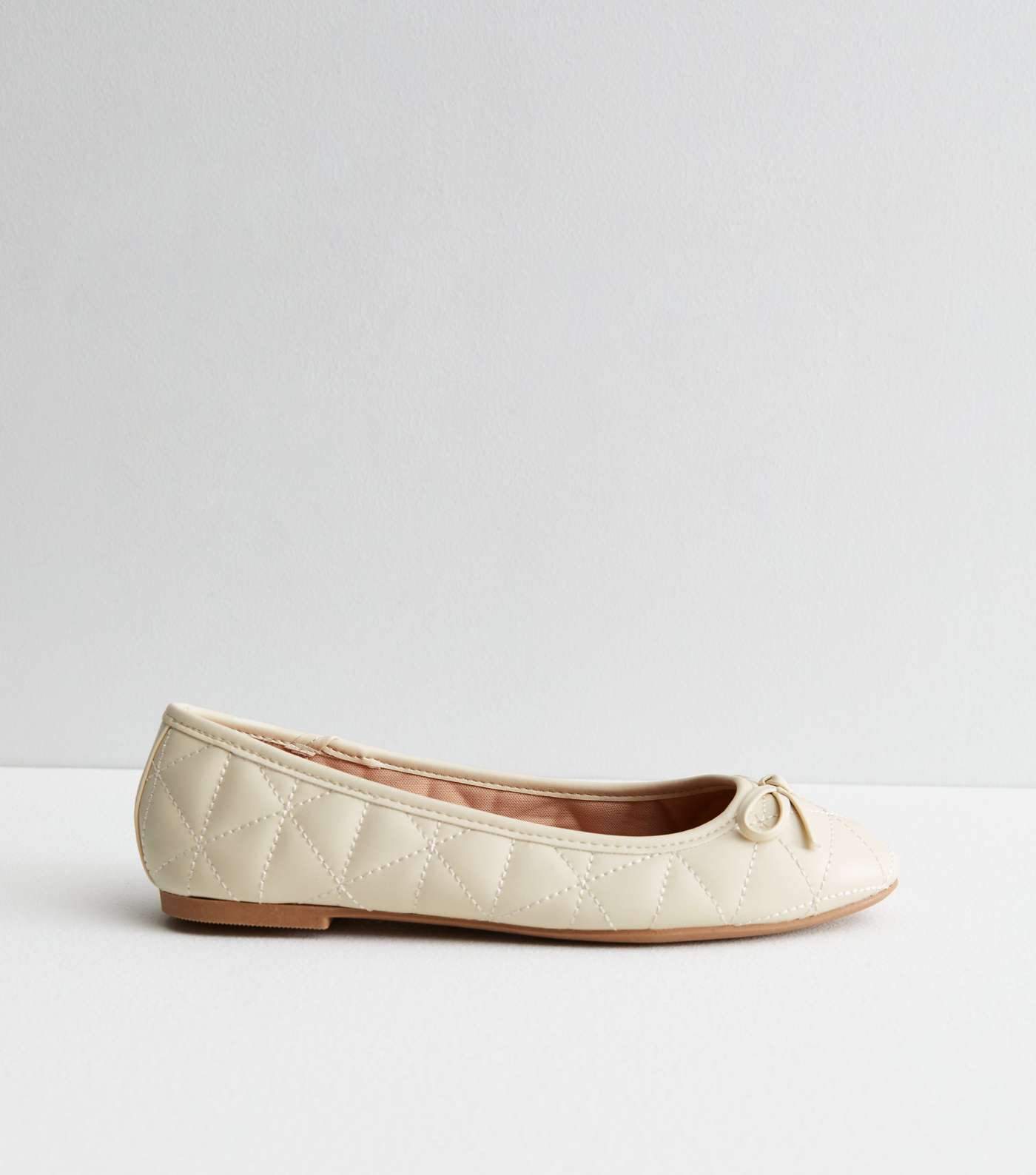 Off White Quilted Bow Ballerina Pumps
