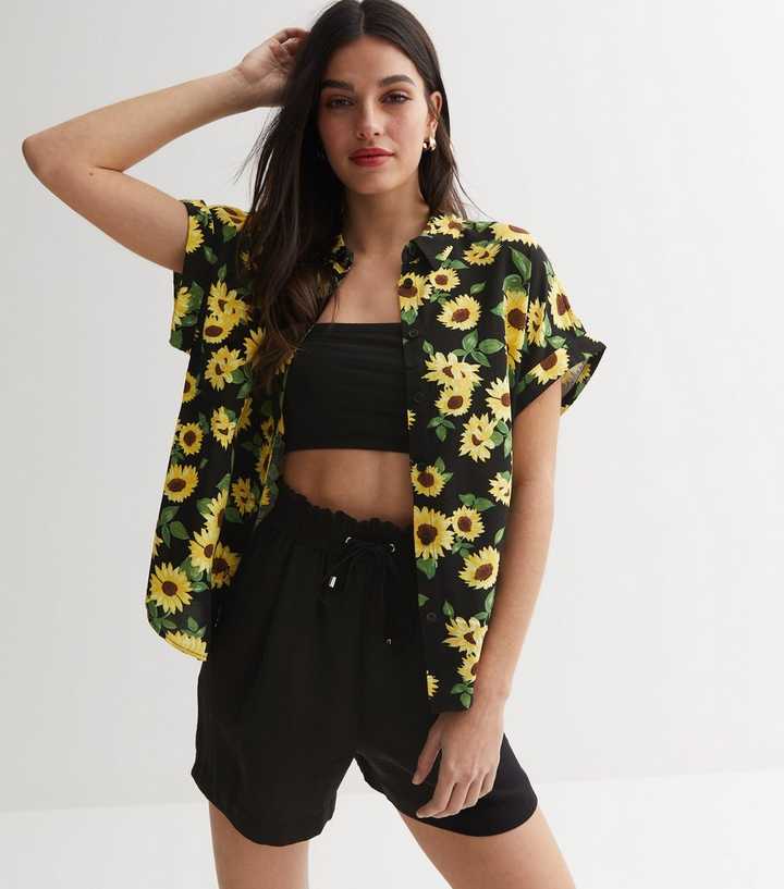 Plus size black sunflower print short sleeve tunic top