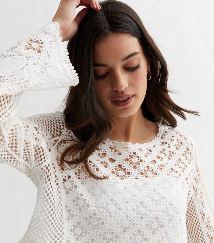 https://media3.newlookassets.com/i/newlook/853157210M1/womens/clothing/tops/white-crochet-long-sleeve-crop-top.jpg?strip=true&qlt=50&w=720