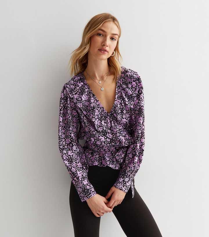 https://media3.newlookassets.com/i/newlook/853220559/womens/clothing/tops/purple-floral-crepe-ruffle-peplum-wrap-blouse.jpg?strip=true&qlt=50&w=720