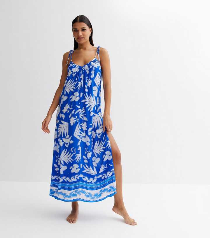 princess polly baby blue dress essential for vacation! a pink and white tropical floral print sundress  with a deep v and layered skirt, stunning beach looks. and ! a floral  holiday dress with thin straps and unique