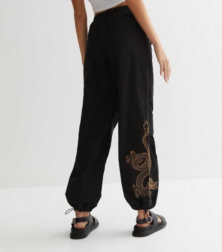 New Girl Order Curve relaxed joggers with logo taping & dragon motif