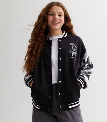 Girl in 2025 varsity jacket