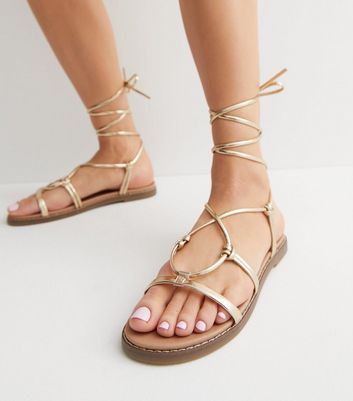 Gold tie up online sandals flat