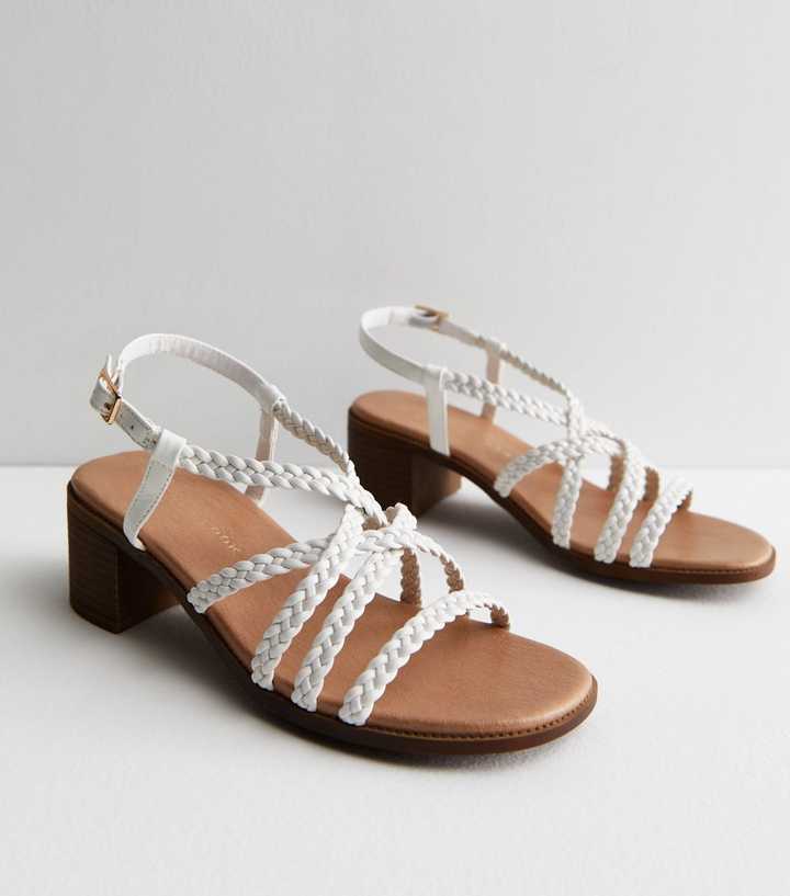 https://media3.newlookassets.com/i/newlook/860494910/womens/footwear/shoes/sandals/wide-fit-white-plaited-mid-block-heel-sandals.jpg?strip=true&qlt=50&w=720
