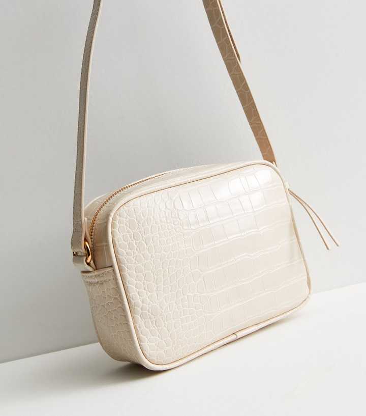 ASOS DESIGN faux leather croc crossbody camera bag in off white