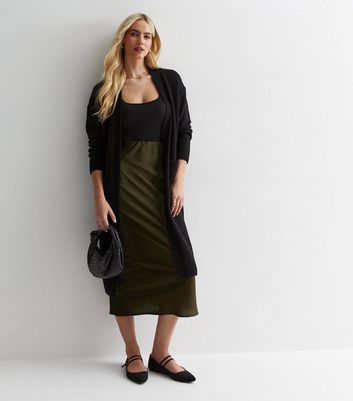 Cardigan over store black dress