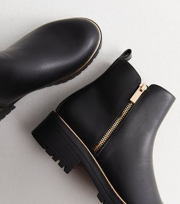 Black ankle 2025 boots gold zip