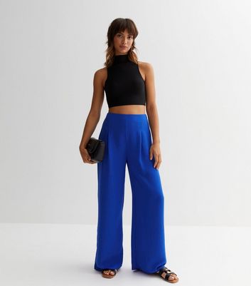 The most stylish wide-leg trousers to wear this summer and beyond