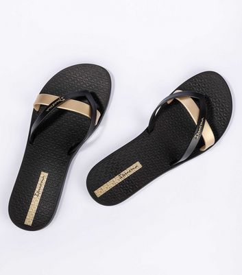 Black and gold flip flops on sale