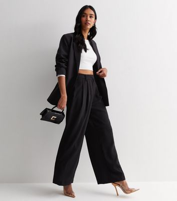 ASOS DESIGN crepe pant with pintuck and chain waist detail in black | ASOS