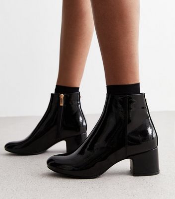 Black patent leather store booties heel