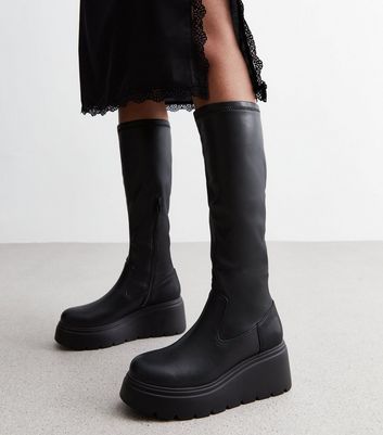 Knee high best sale leather wedge boots