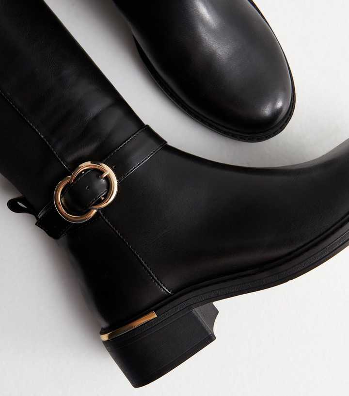 black riding boots with buckles