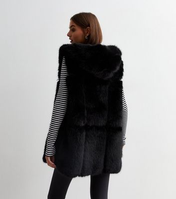 Faux fur outlet vest with hood