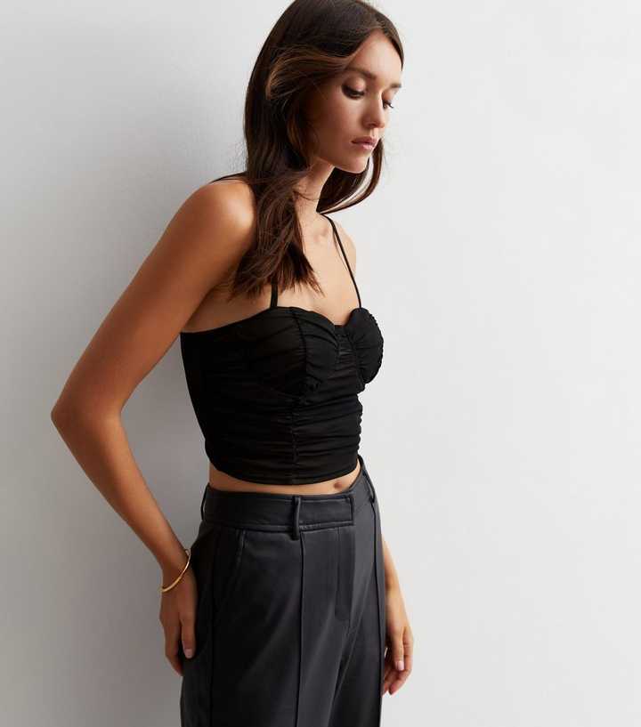 https://media3.newlookassets.com/i/newlook/879099201/womens/clothing/tops/cameo-rose-black-mesh-strappy-corset-top.jpg?strip=true&qlt=50&w=720