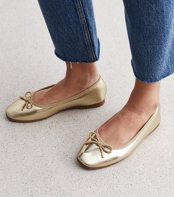 Gold leather shop flat shoes