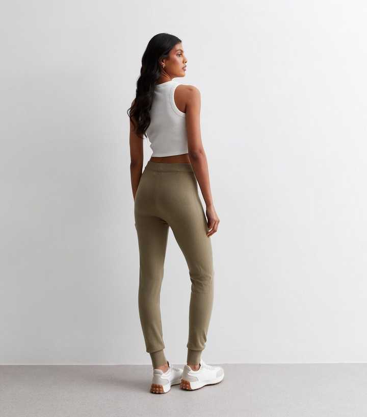 https://media3.newlookassets.com/i/newlook/882909121M3/womens/clothing/sportswear/gini-london-light-brown-high-waist-cuffed-leggings.jpg?strip=true&qlt=50&w=720