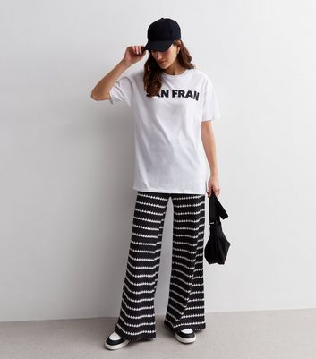 Black and white striped palazzo best sale pants outfit