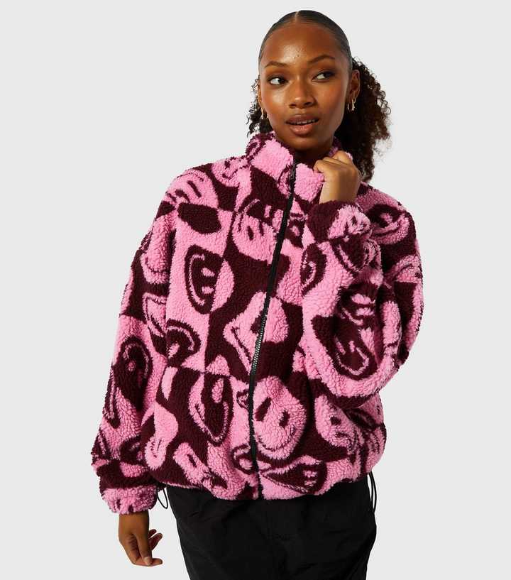 https://media3.newlookassets.com/i/newlook/884291773/womens/clothing/coats-jackets/skinnydip-mid-pink-happy-face-print-fleece-jacket.jpg?strip=true&qlt=50&w=720