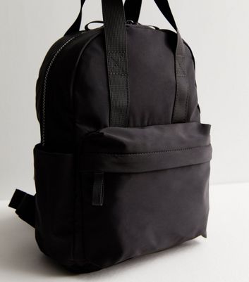 Asos design zip over canvas backpack with double outlet handle