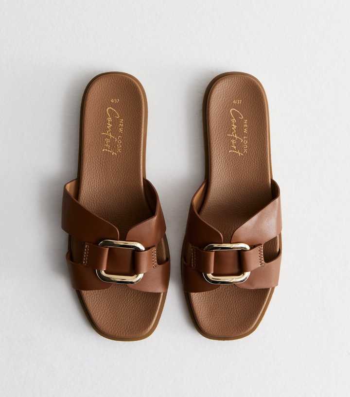 https://media3.newlookassets.com/i/newlook/885595418/womens/footwear/shoes/tan-leather-look-buckle-sliders.jpg?strip=true&qlt=50&w=720