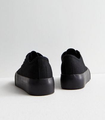 Black canvas shoes hot sale with white laces