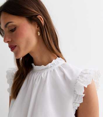 White Cotton Embroidered Frill Sleeve Top