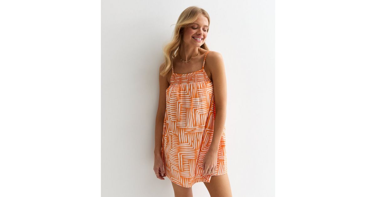 Coastal Caravan Smocked Dress In Neon Orange