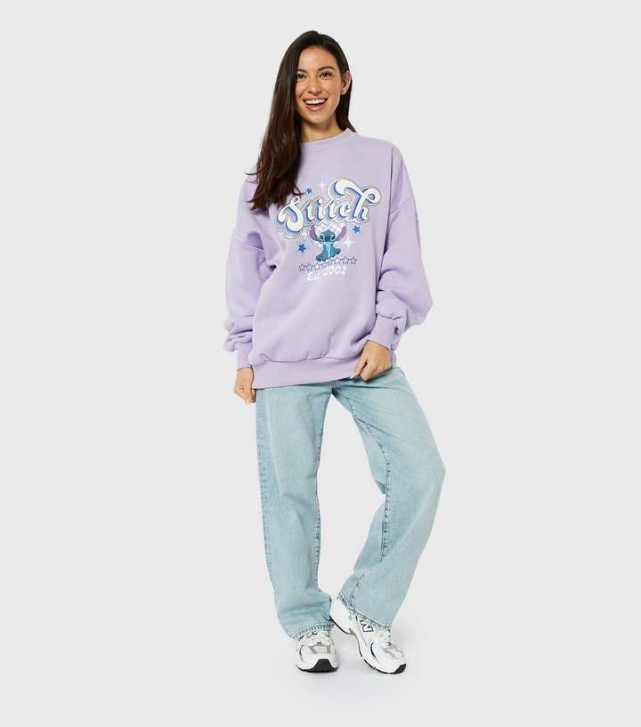 https://media3.newlookassets.com/i/newlook/891512304M1/womens/clothing/hoodies-sweatshirts/skinnydip-lilac-disney-stitch-logo-sweatshirt.jpg?strip=true&qlt=50&w=720