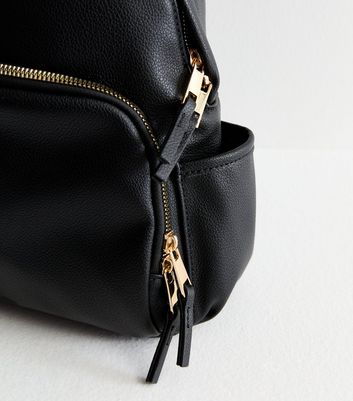 Black backpack with gold zipper hotsell