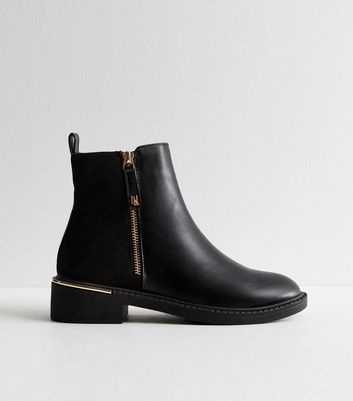 Black boots with gold zipper best sale