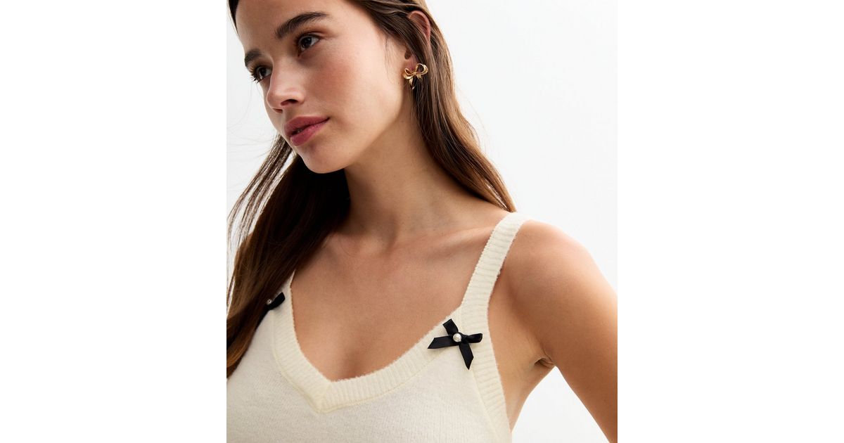 All over bow knit vest