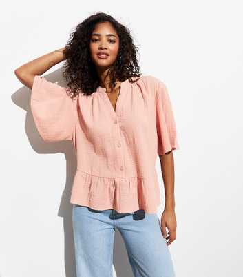 Pink Textured Cotton Peplum-Hem Blouse