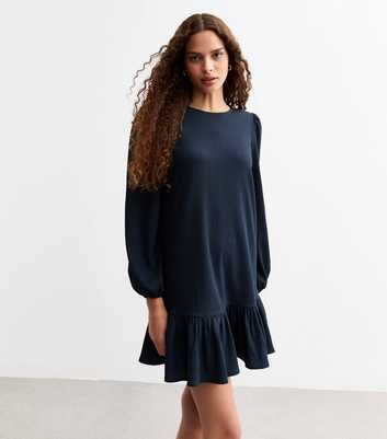 Textured Frill Hem Long Sleeved Mini Dress