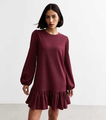 Burgundy Textured Frill Hem Long Sleeved Mini Dress