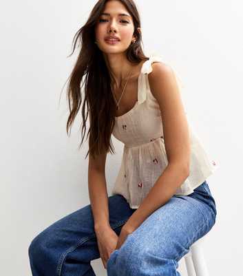 White Textured Floral Embroidered Tie Strap Flared Cami Top