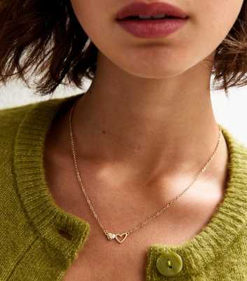 Gold Tone Cut Out Heart Pendant Necklace