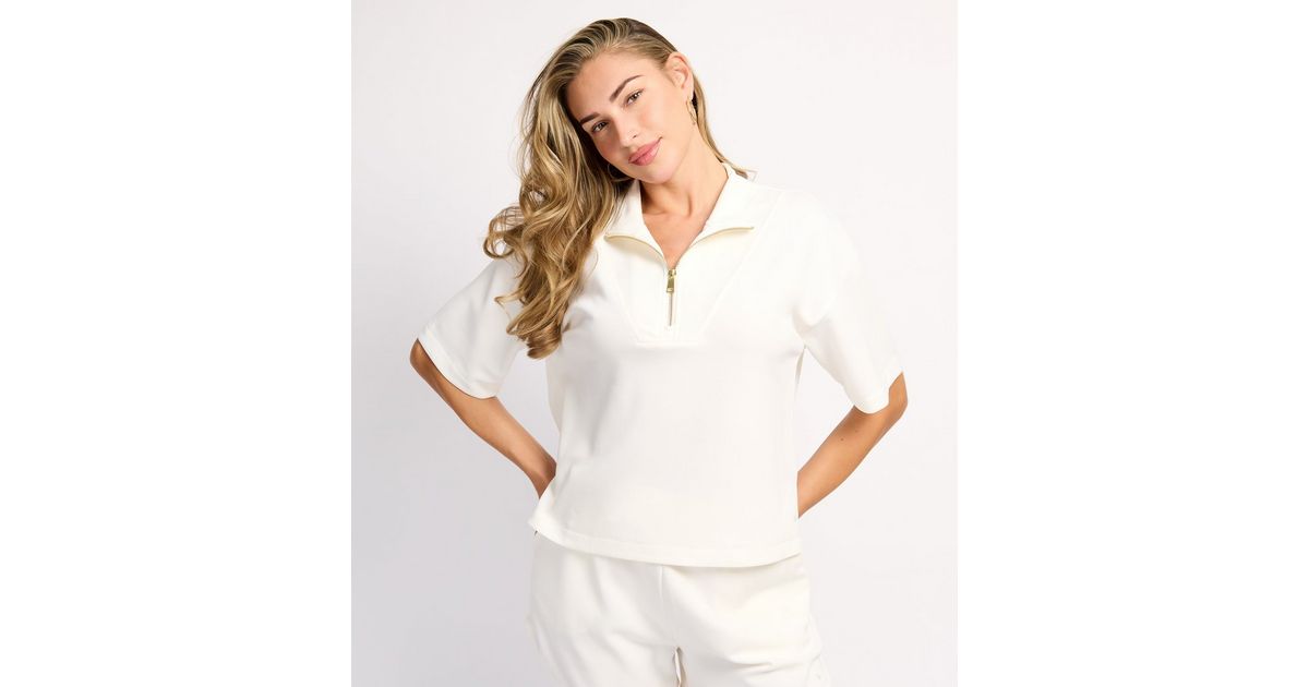 Rise by Zara McDermott Off White Scuba Quarter Zip Short Sleeve Top New  Look