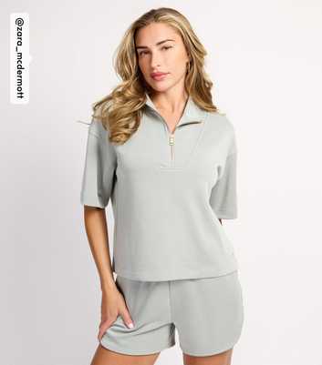 Rise by Zara McDermott Light Green Scuba Quarter Zip Short Sleeve Top